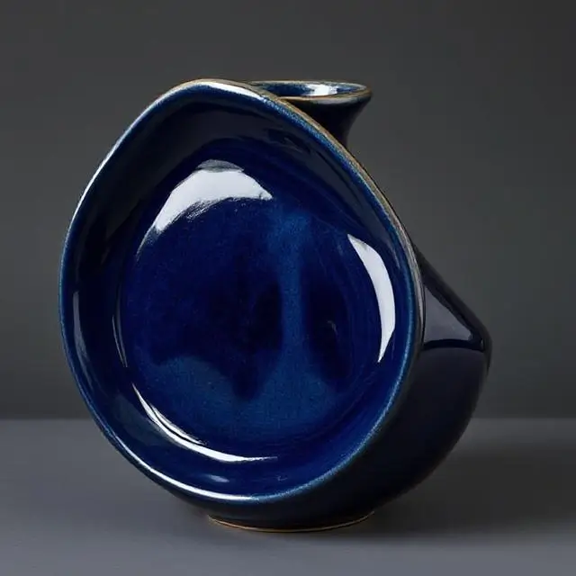 Ceramic piece in deep navy blue.