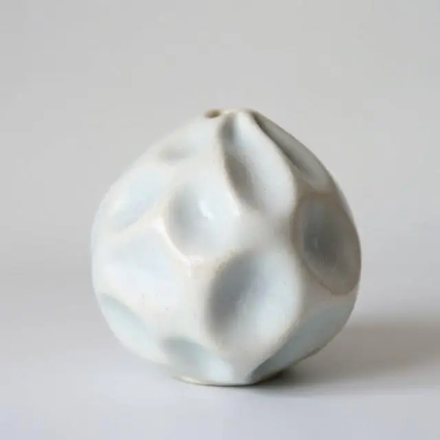 Ceramic piece in a soft, misty light blue.