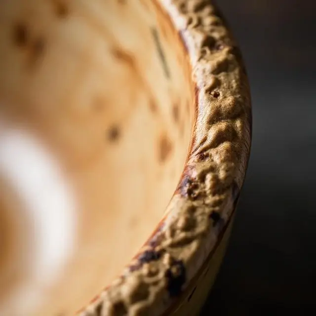 Close up of the textured rim of a bowl.